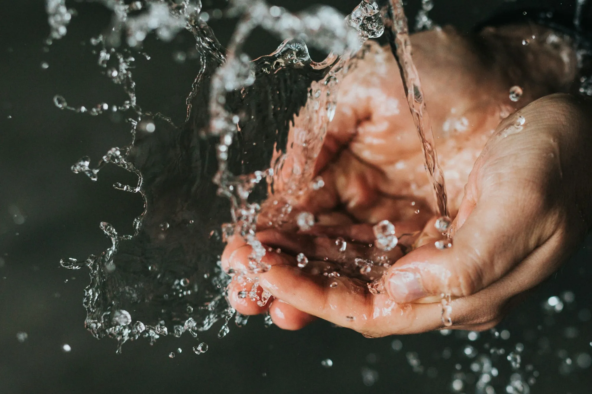 Local Water Experts Who Recommend Only What You Need Running water splashing over cupped hands