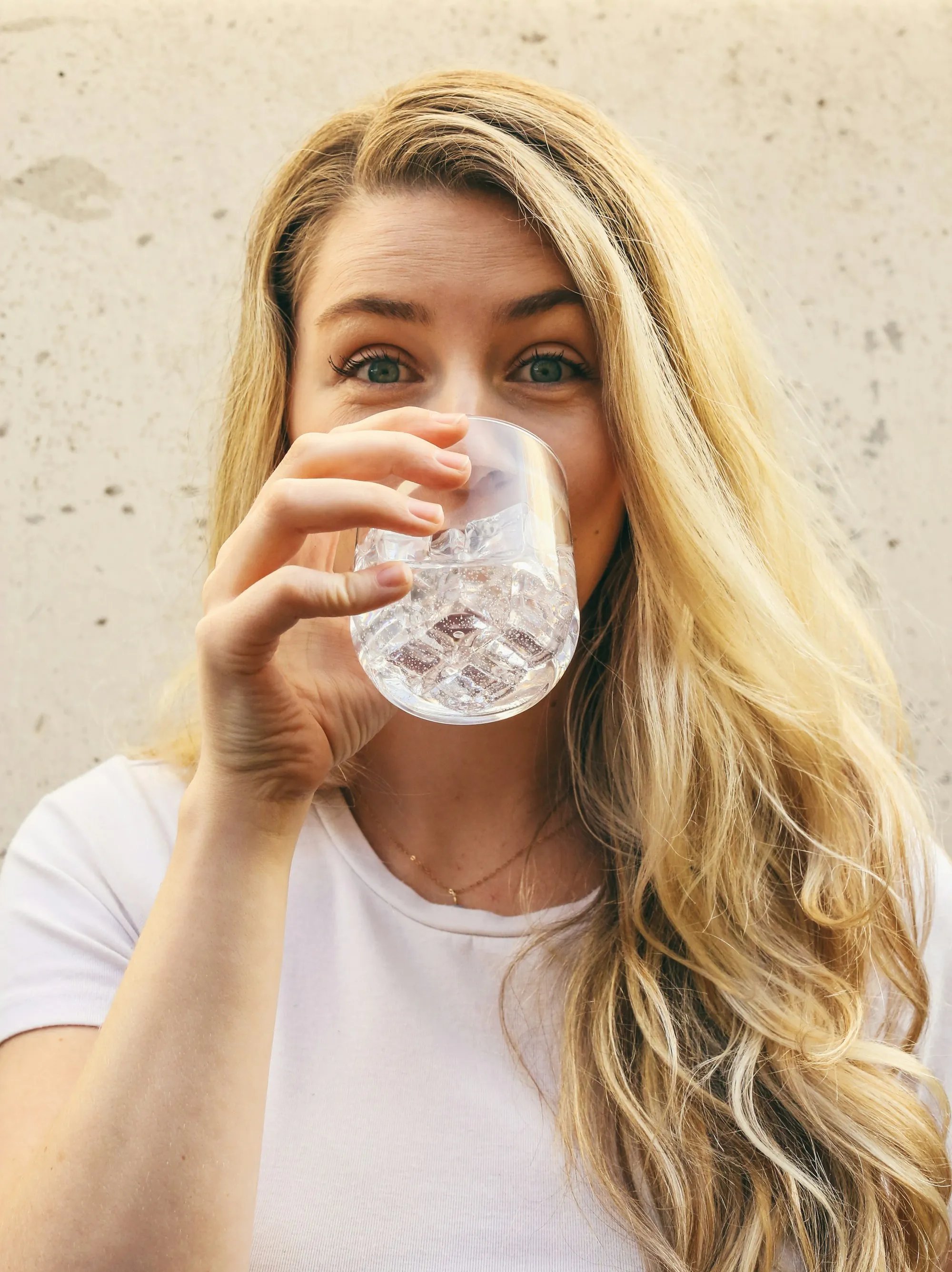 About Fountain Valley Water Systems Woman drinking a glass of water